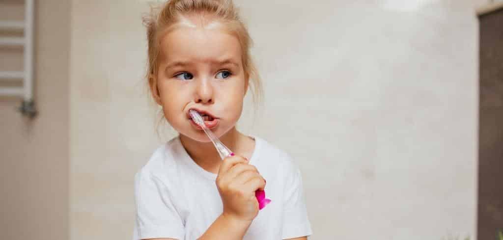 A child brushing her teeth