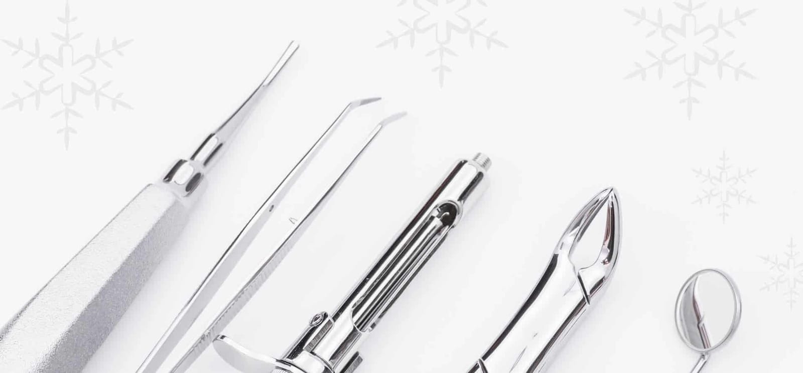 Dental instruments against a background with snowflakes