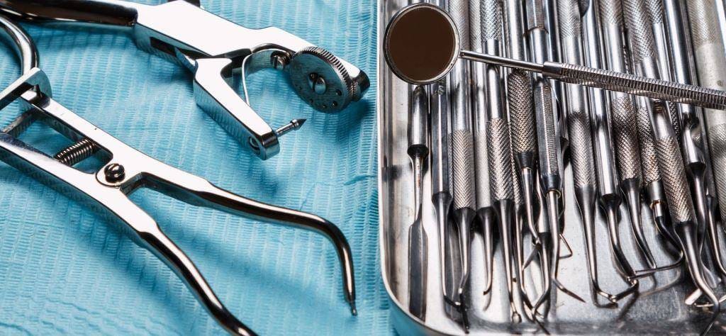 Dental instruments laid out on a tray