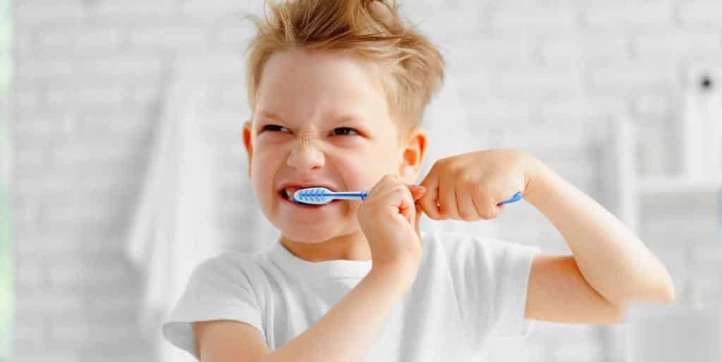 A child brushing their teeth.