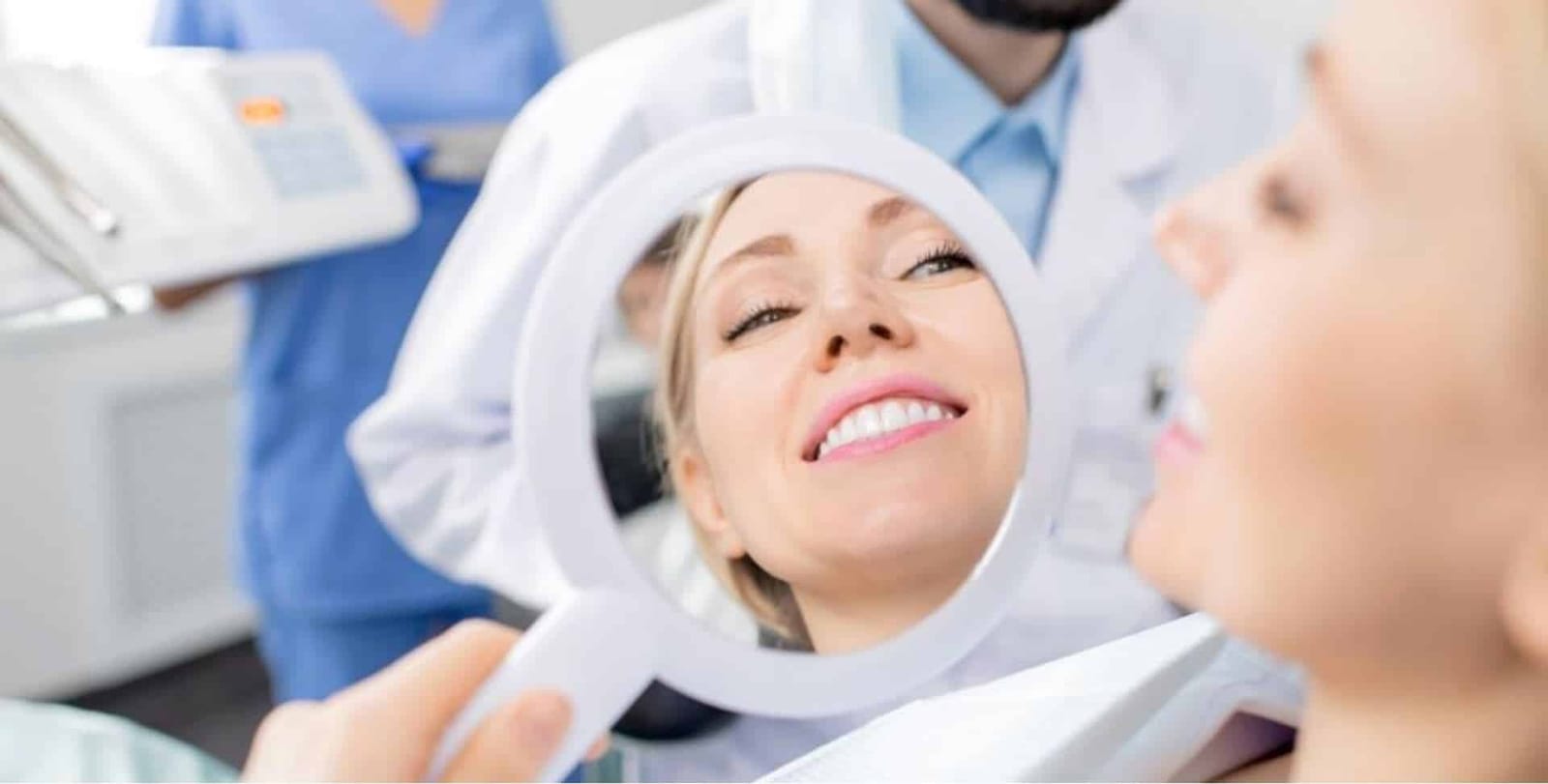 A patient looking at their smile in a mirror