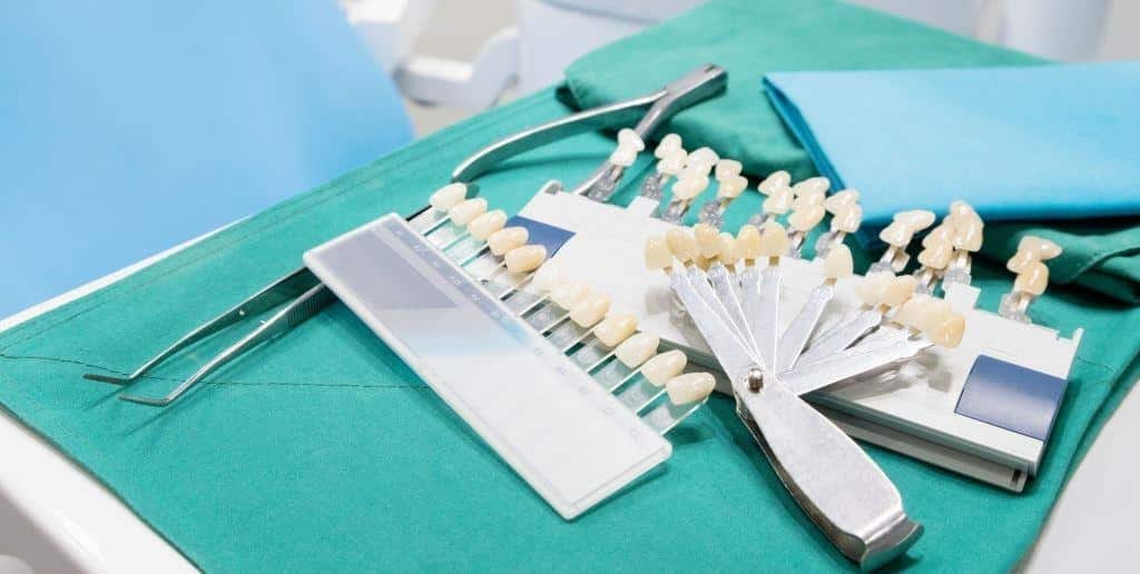 Dental instruments and tooth shade guides on a tray