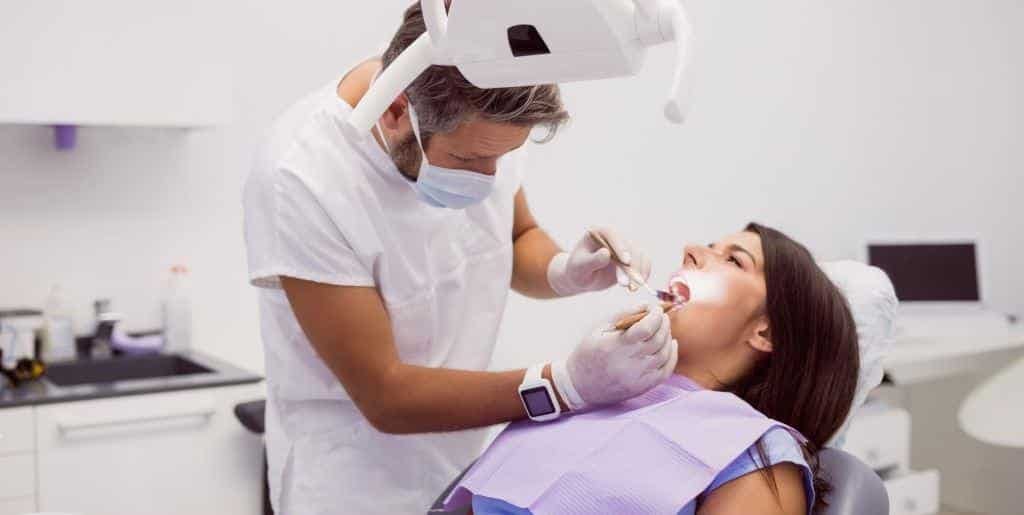 Patient receiving dental care in a surgery