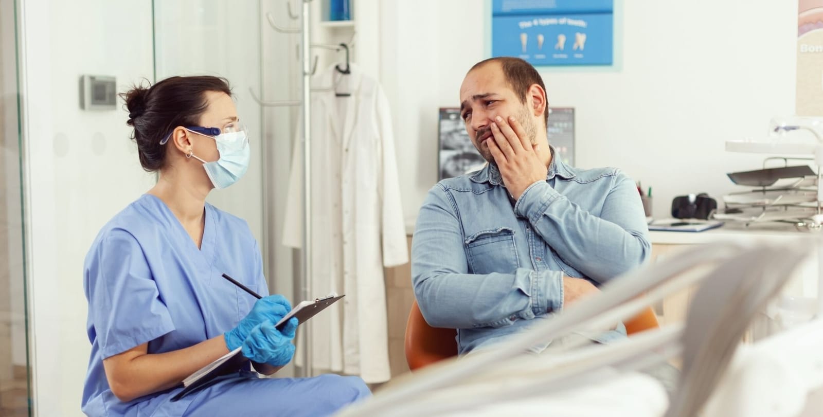A patient discussing discomfort with a dental professional