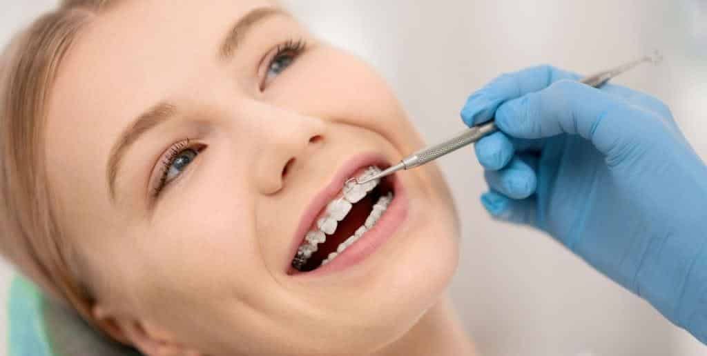 A patient having fixed braces checked