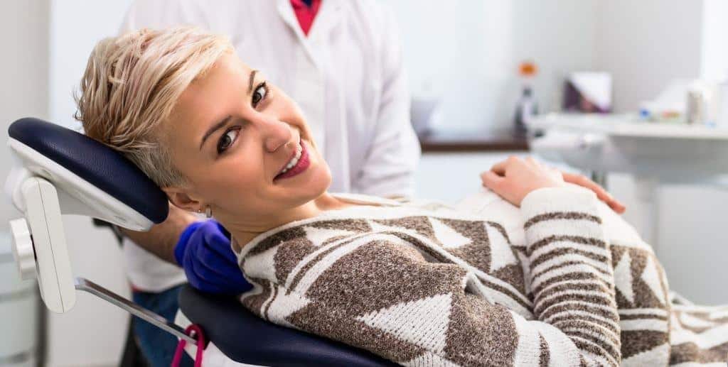 A patient sitting in a dental chair