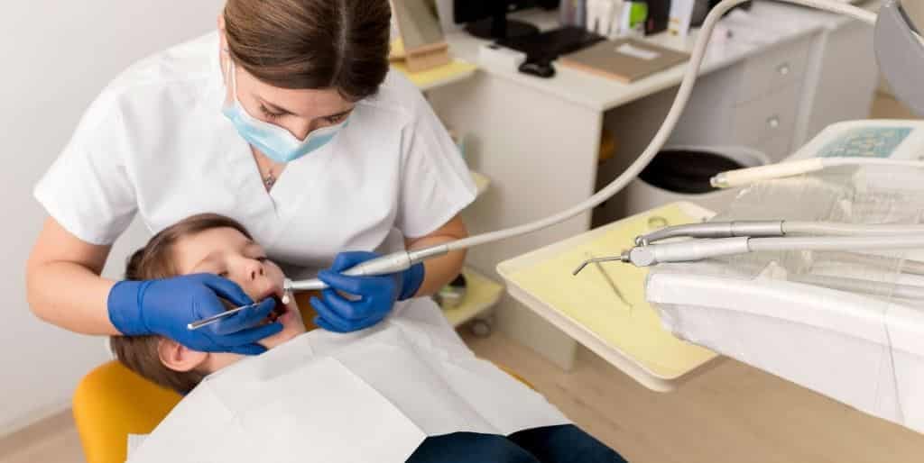Child receiving dental treatment