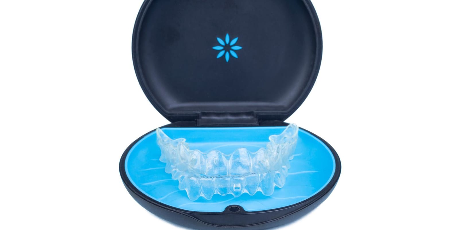A clear dental tray in its case