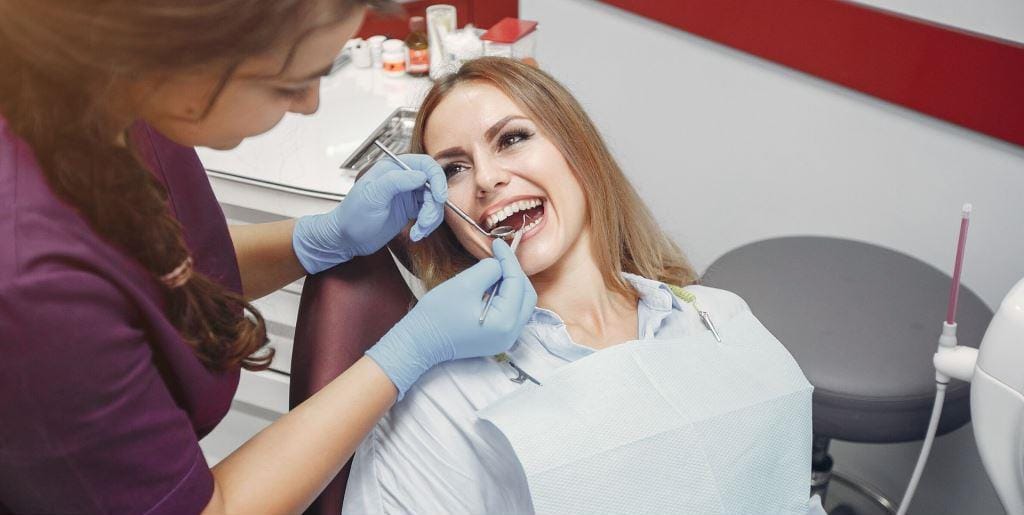 Dental team examining a patient