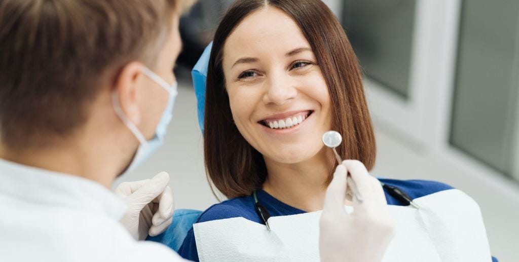 A smiling patient during a dental examination