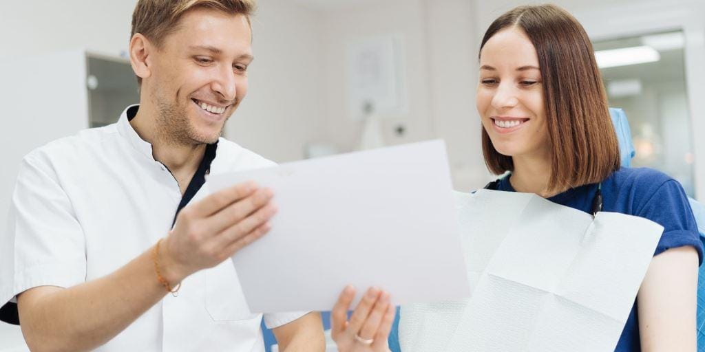 Two people looking at documents together
