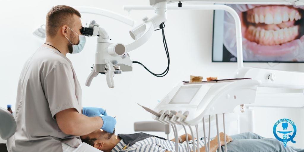 Dentist using a microscope during treatment