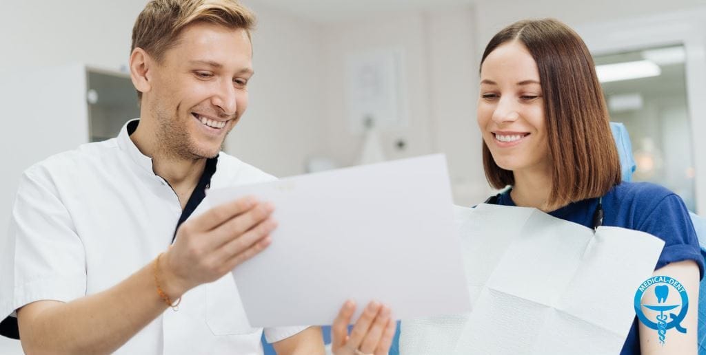 Clinician and patient looking at paperwork together