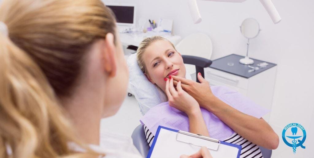 A patient discussing a concern about her mouth during a dental appointment