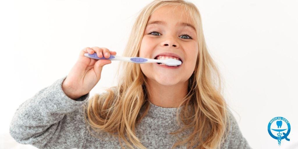 A child brushing their teeth