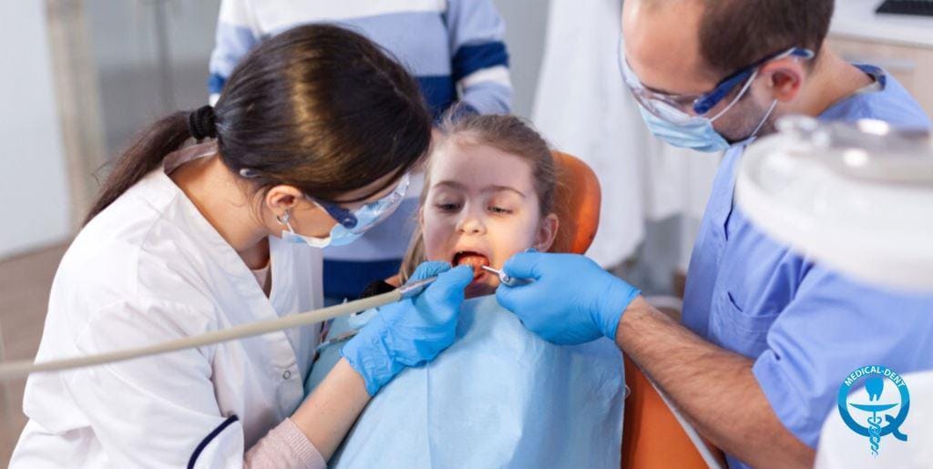 A dental team treating a child