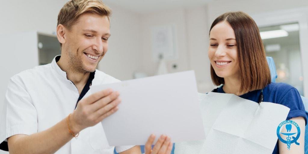 A clinician and patient looking at paperwork together