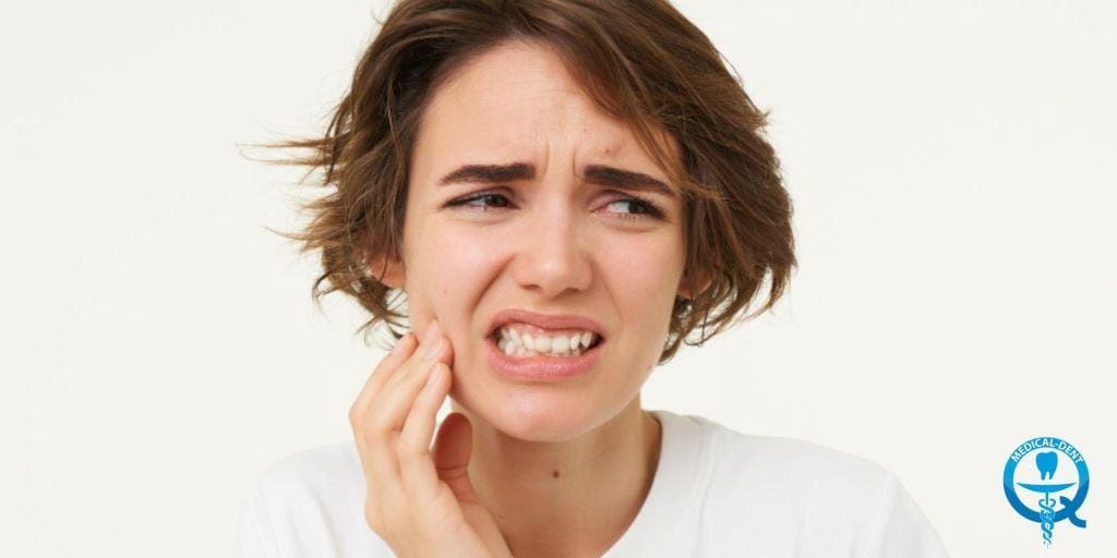 A woman touching her cheek