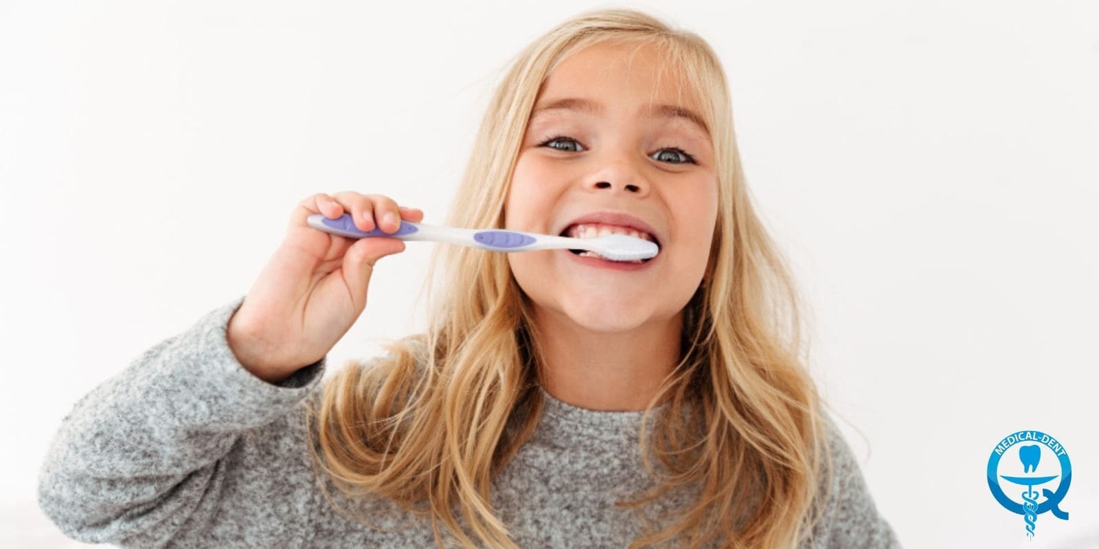 A child brushing their teeth