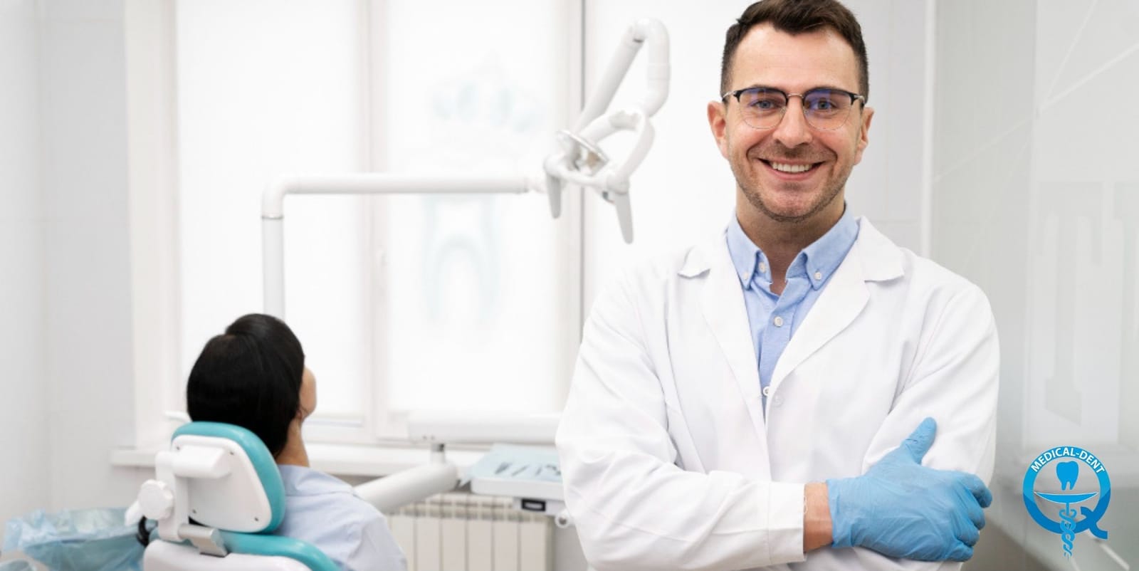 A dental professional standing beside a treatment chair