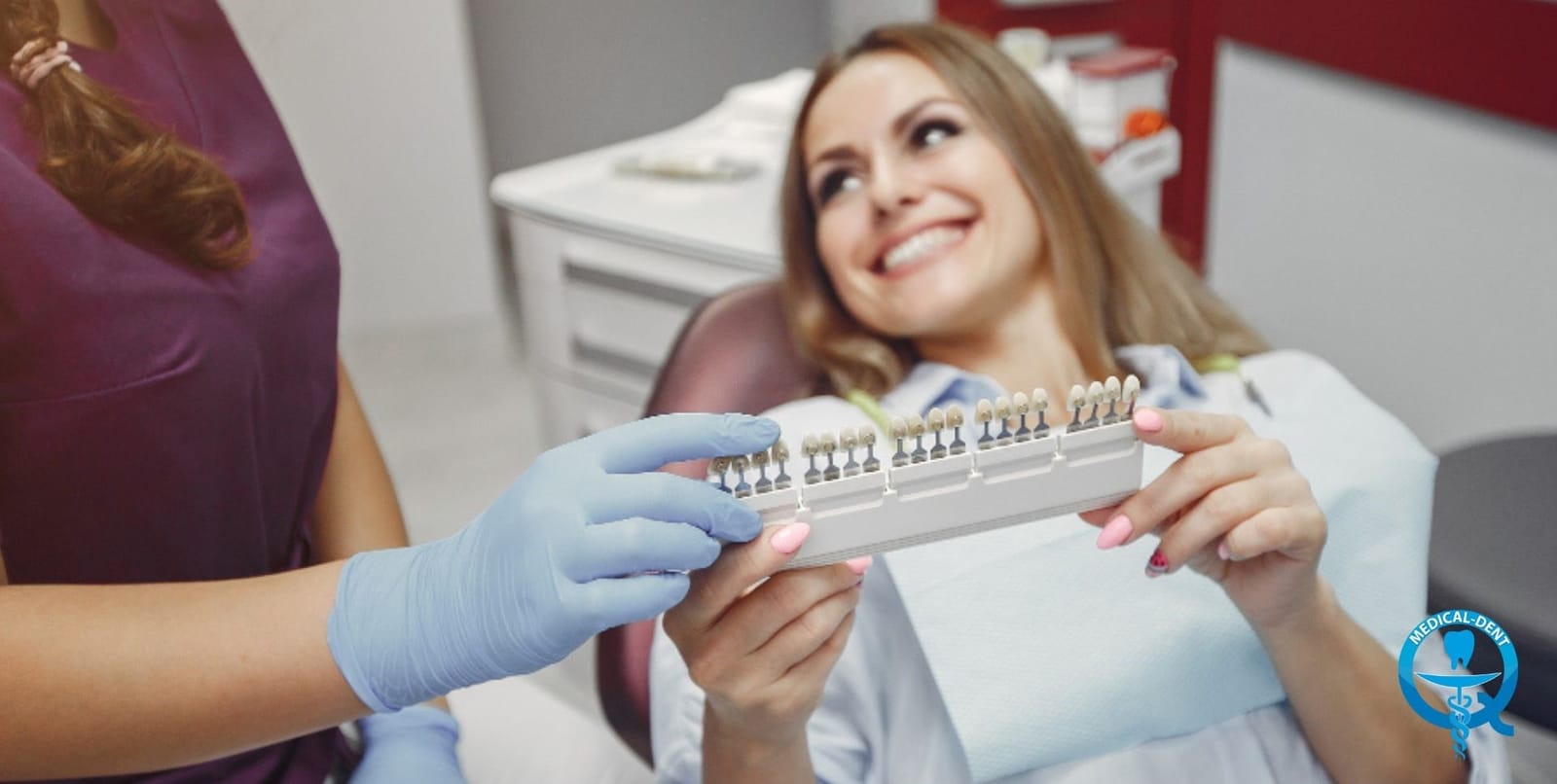 A patient and clinician holding a tooth shade guide