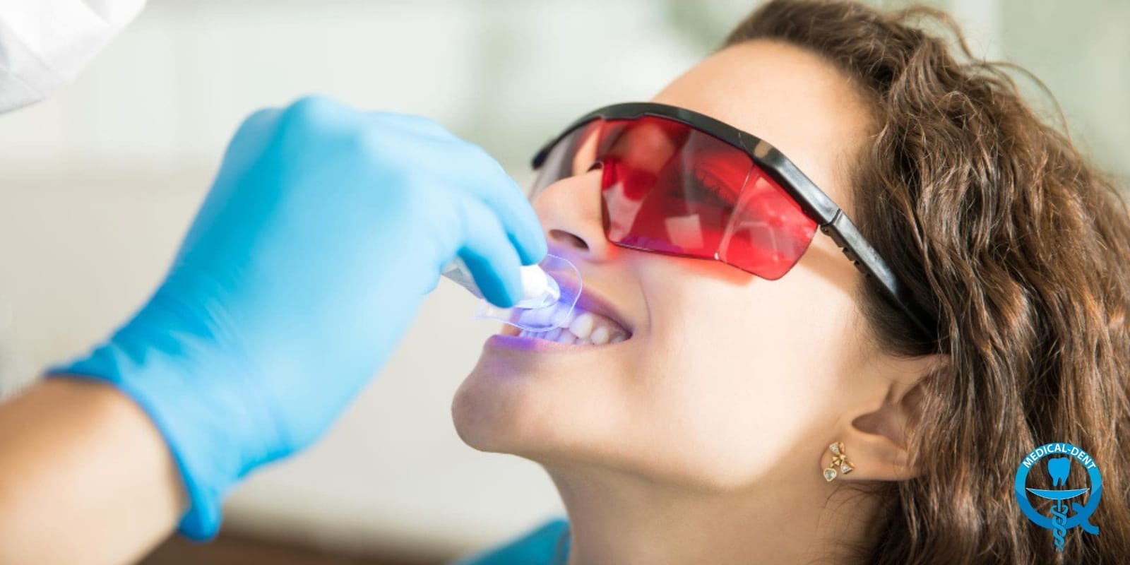 A patient wearing protective glasses during dental treatment