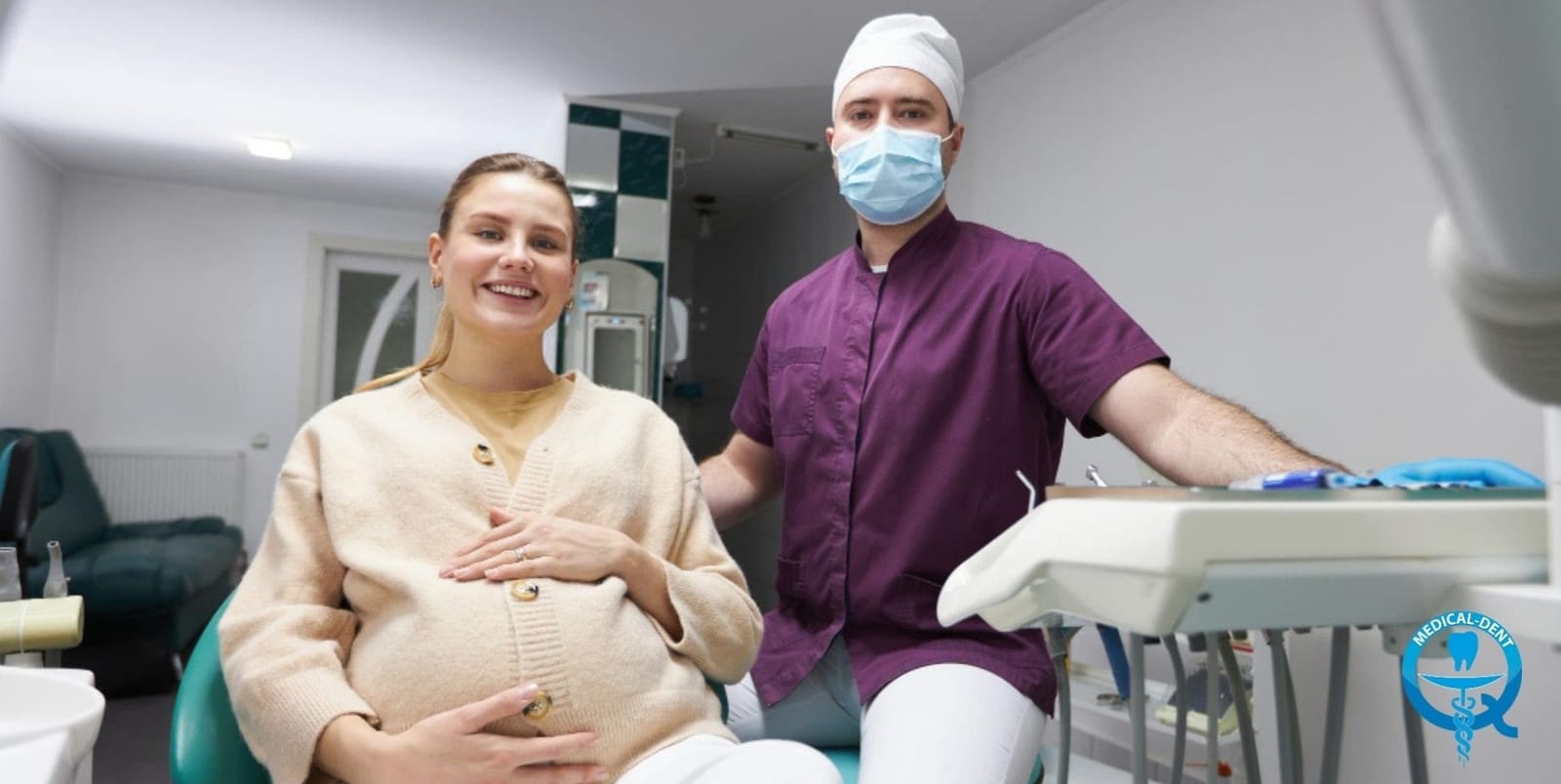 Pregnant patient with a dental professional in a surgery