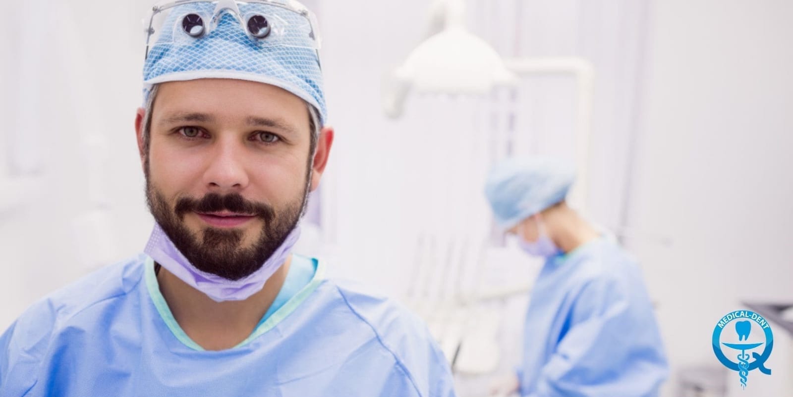 A clinician wearing a surgical cap and magnifying loupes