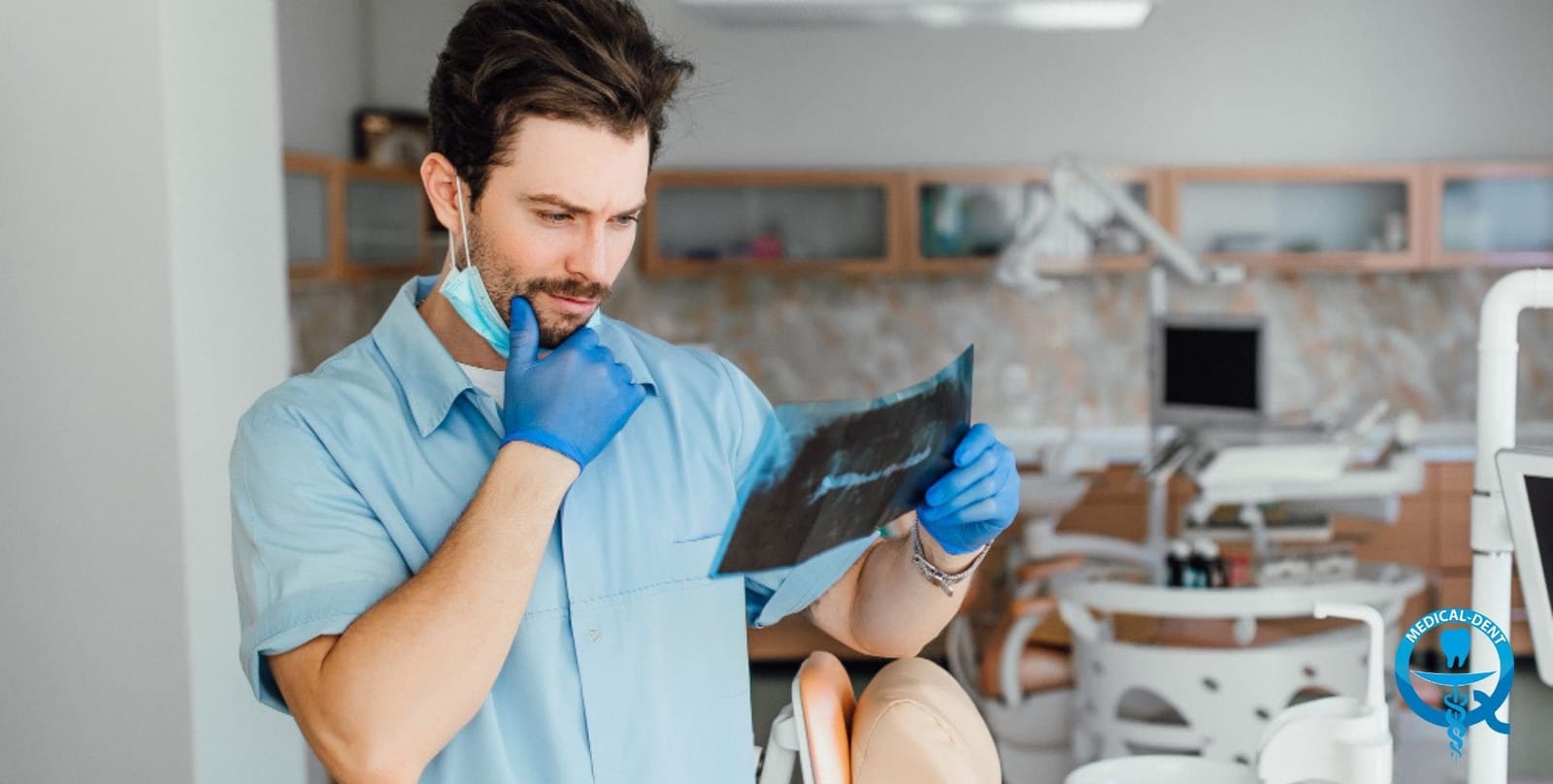 A clinician looking at a dental X-ray