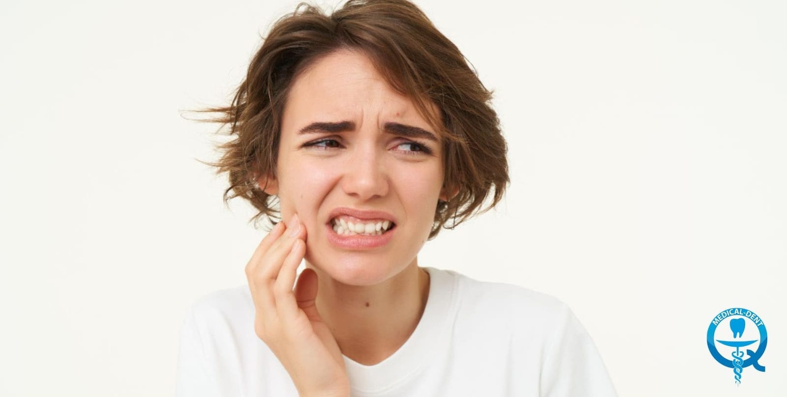 A woman touching her cheek