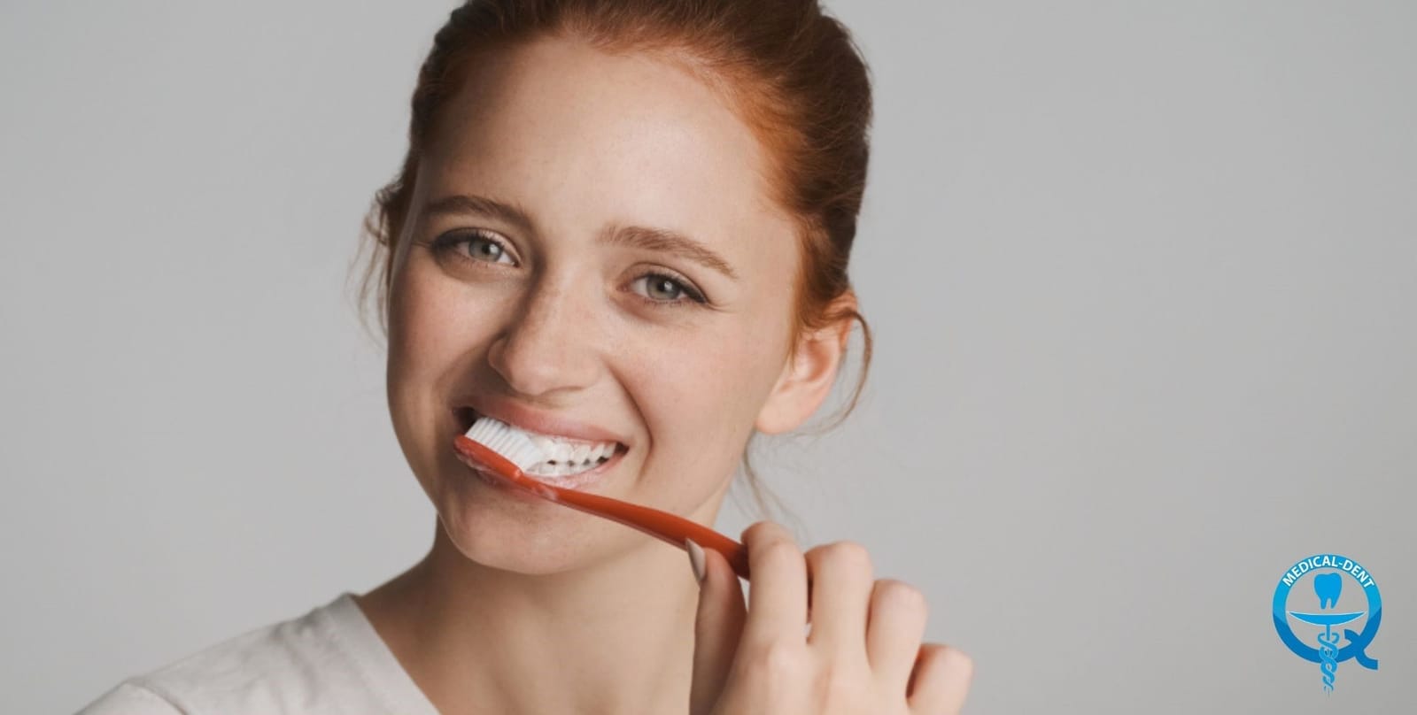 A woman brushing her teeth
