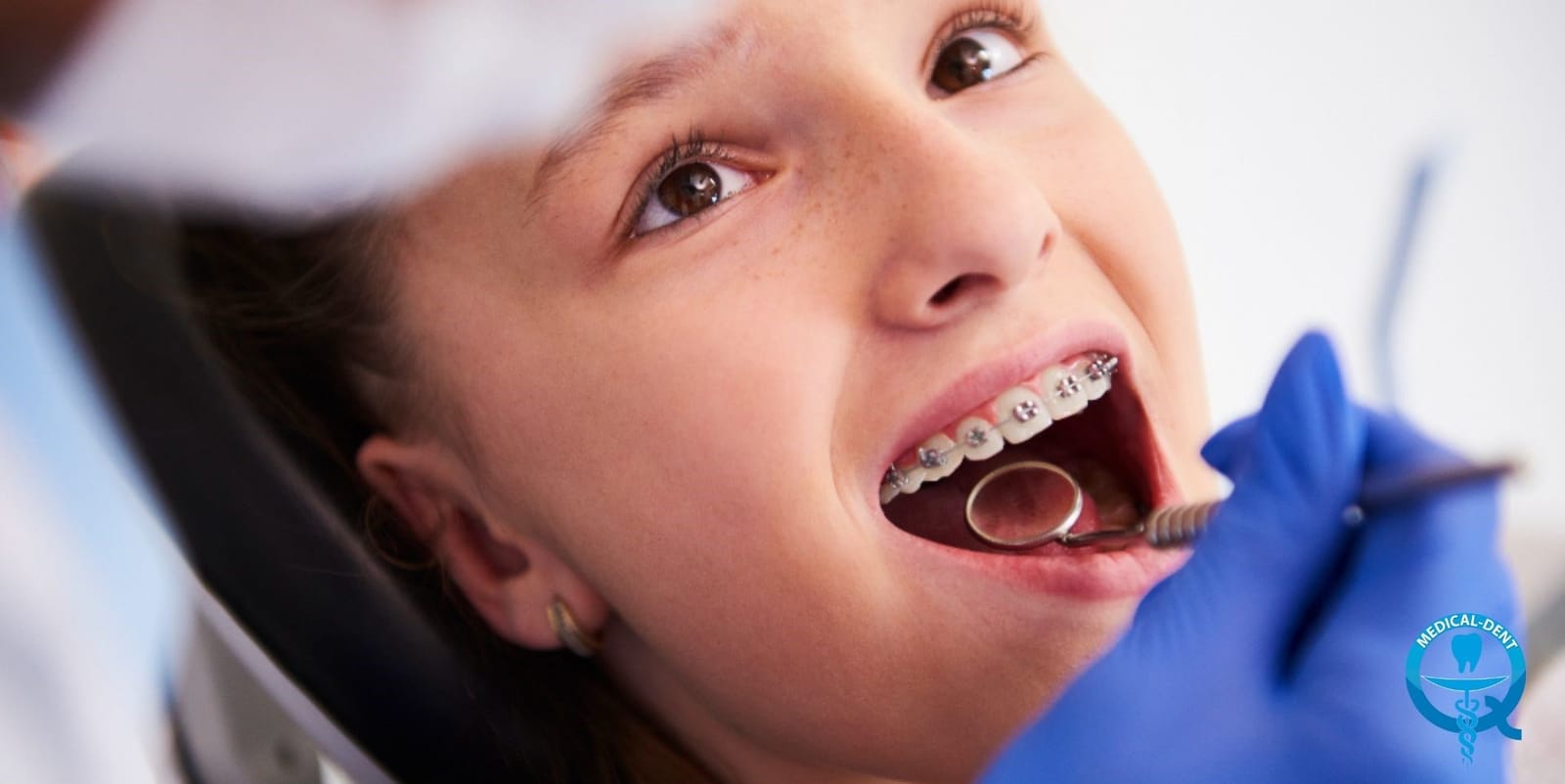 A patient with fixed braces having a dental examination