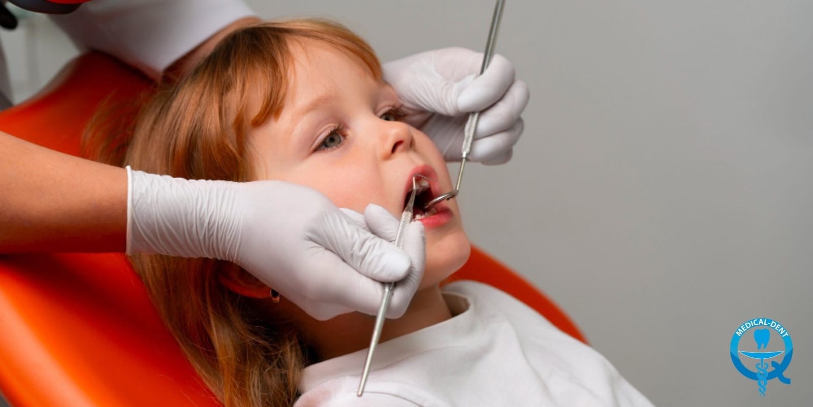 A child having their teeth examined