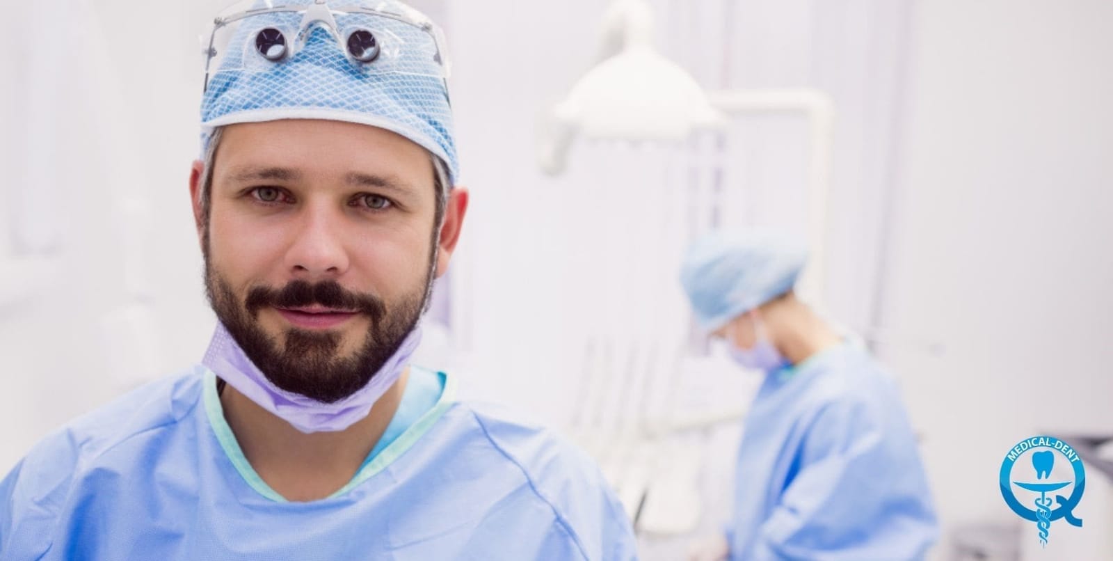 A person wearing surgical clothing and magnifying loupes