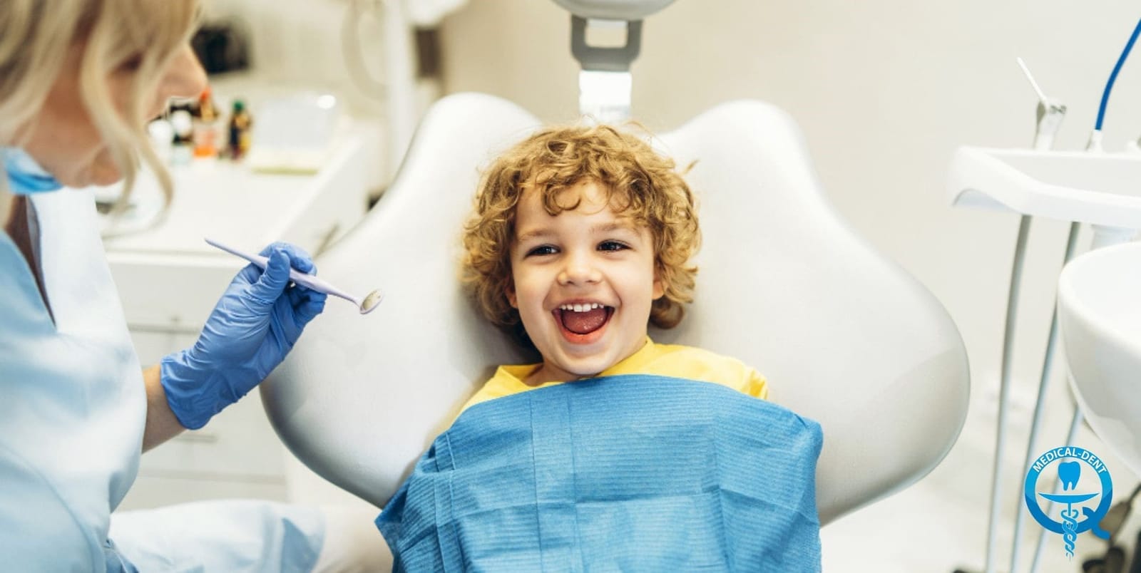 Child smiling in a dental chair
