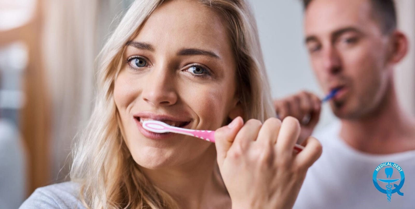 Two people brushing their teeth