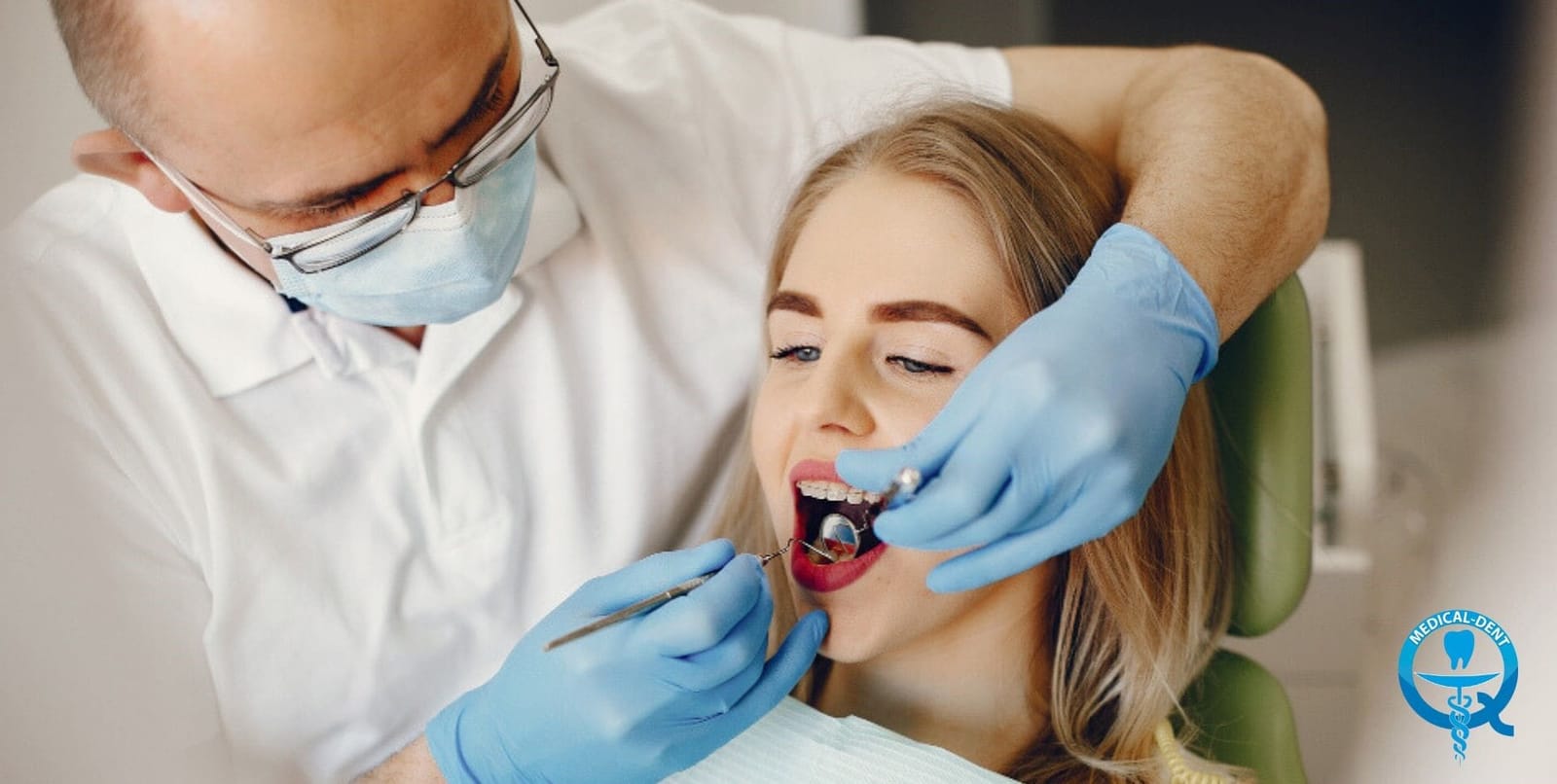 A clinician using a dental mirror during an examination