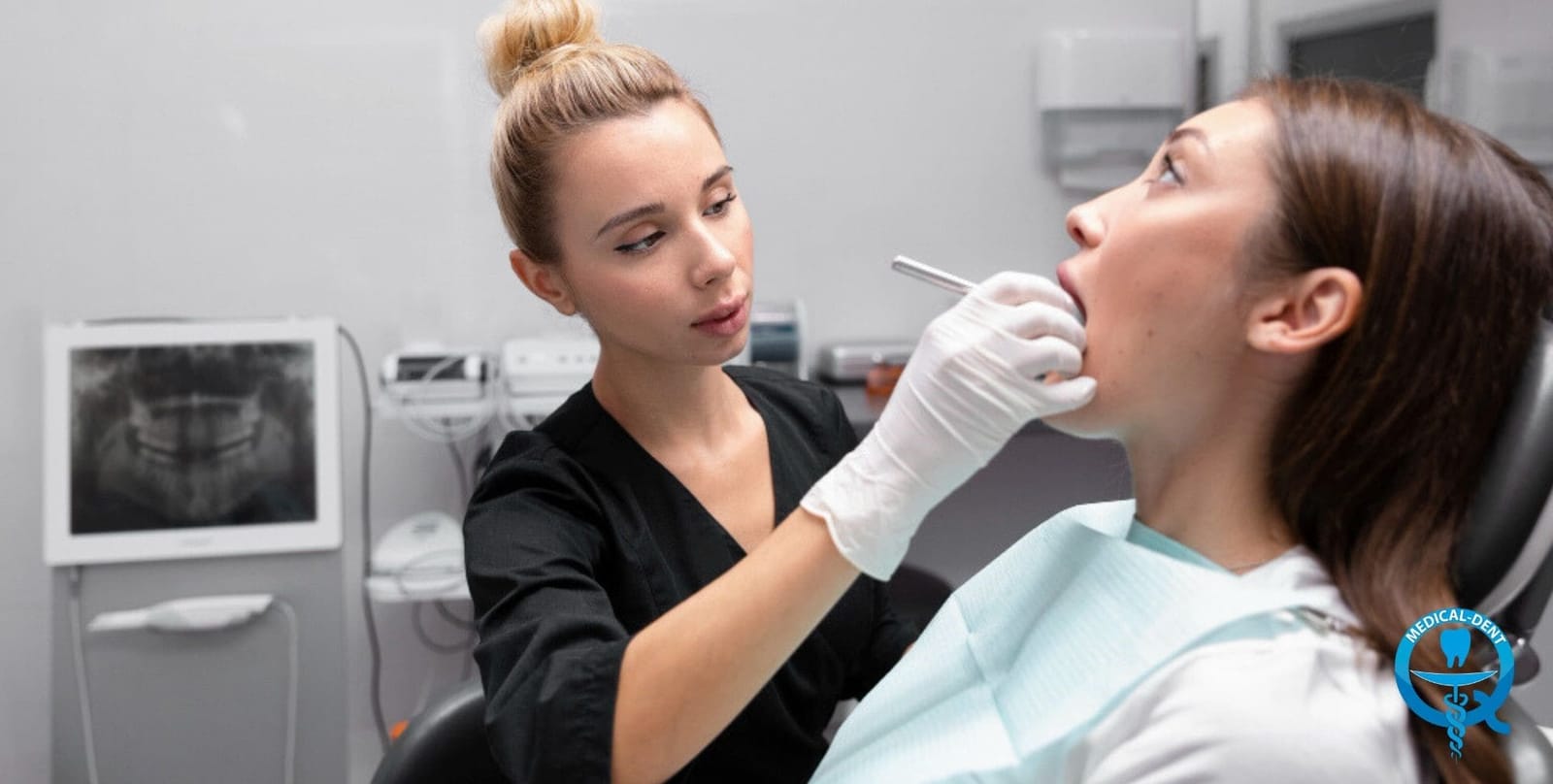 A clinician examining a patient’s mouth