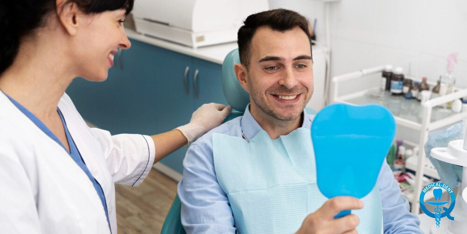 Patient holding a blue tooth-shaped mirror during a dental appointment