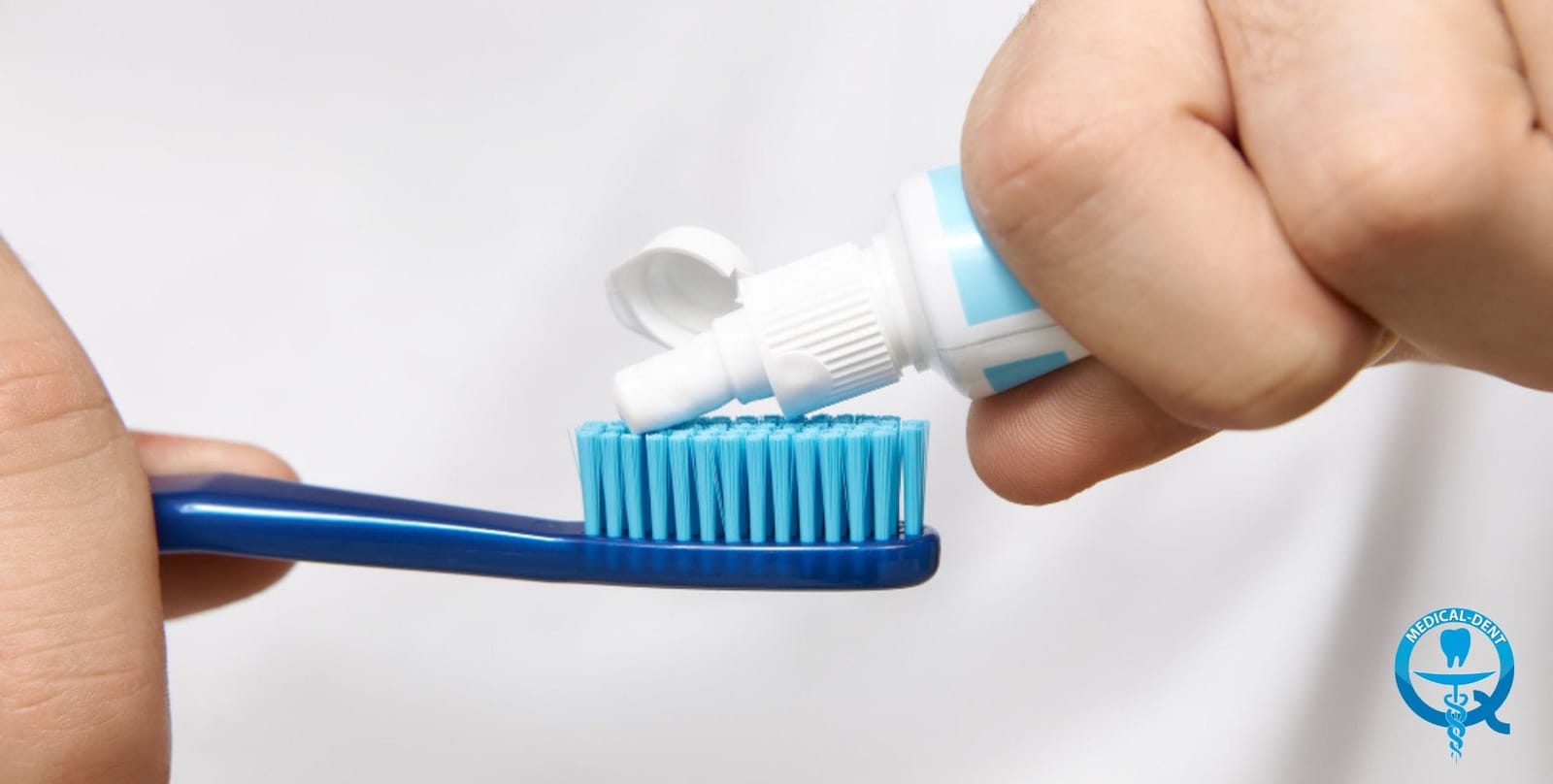 Toothpaste being applied to a toothbrush