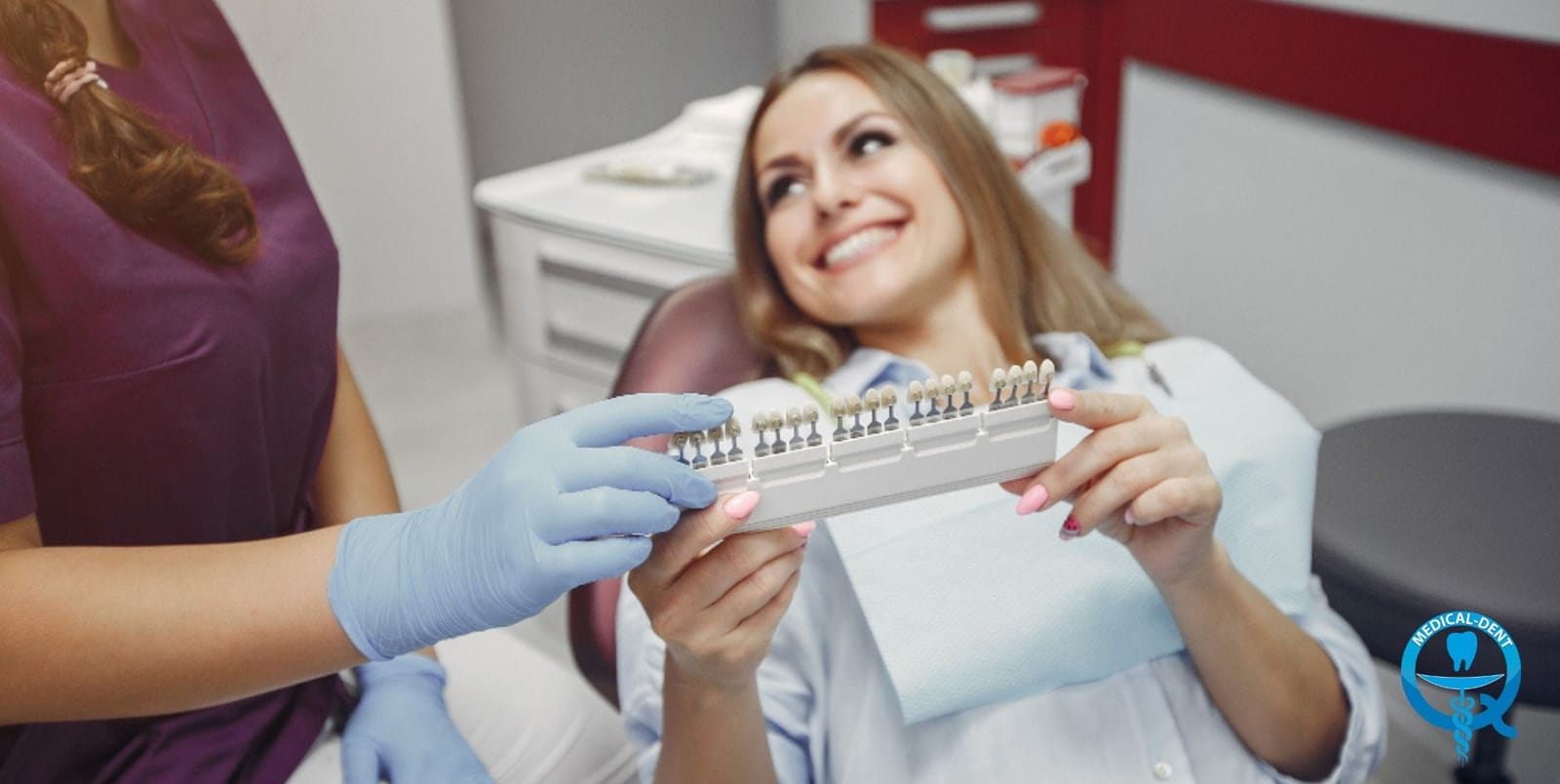A patient and dental team member holding a tooth shade guide