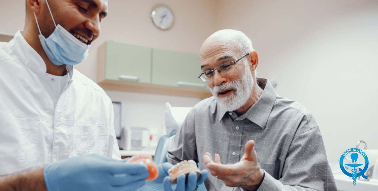 A clinician discussing a dental model with a patient