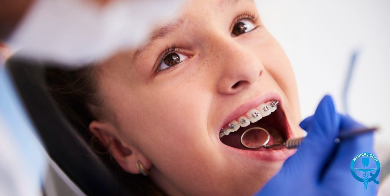 Patient with fixed braces having a dental examination
