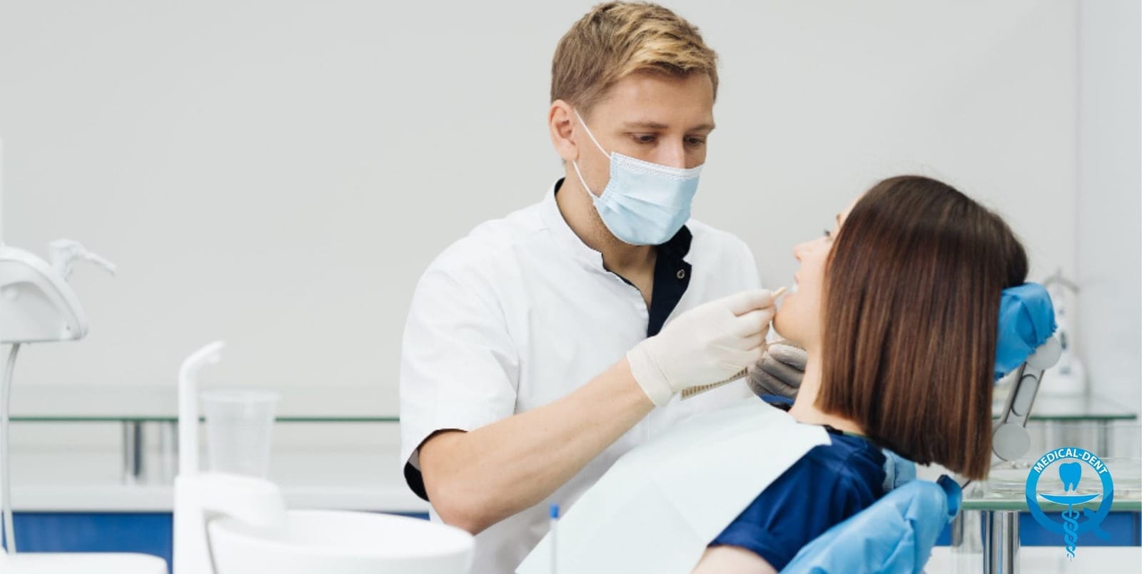 A dentist examining a patient in the dental chair
